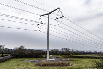 Infrastructure such as new ‘T’ style electricity pylons is needed to electrify Britain (Ben Birchall/PA)